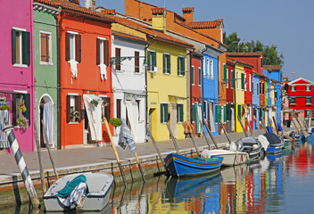 Fototapeta na wymiar Italy. Burano island near Venice. Romantic canal with old small