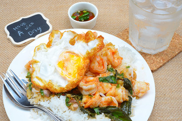 fried shrimps with chilli paste and basils, rice and fried egg topping
