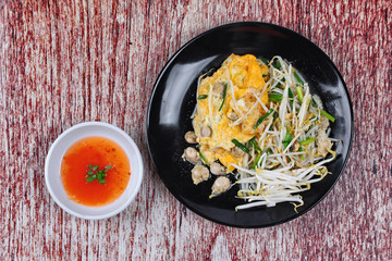 Thai food,Fried egg and oyster with bean sprouts and shallot as
