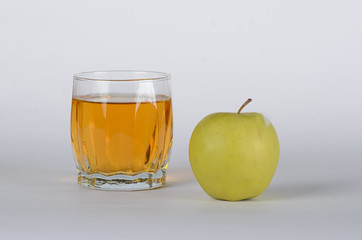 Apple with glass of juice
