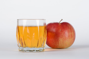 Apple with glass of juice