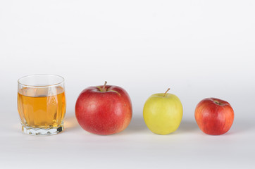 Apples and juice in glass