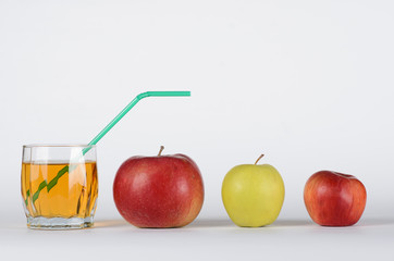 Apples and juice in glass 