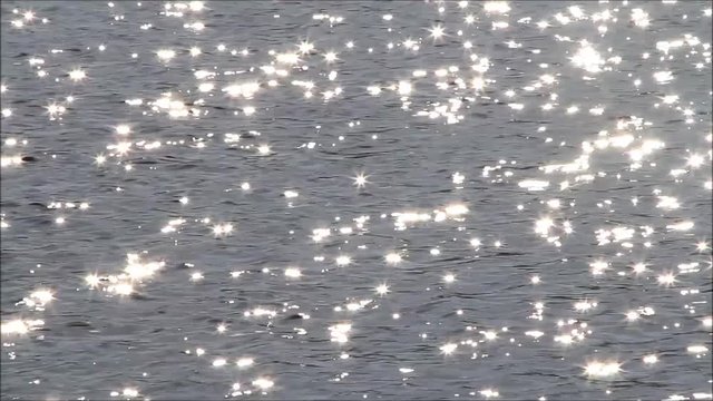 sun stars reflections on water
