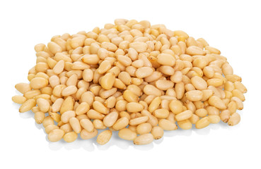 Pile of pine nuts closeup isolated on white background.