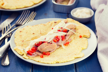 bread with tuna salad on plate on blue wooden background