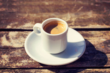cup of coffee on wooden table