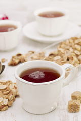 cup of tea with cookies on wooden background