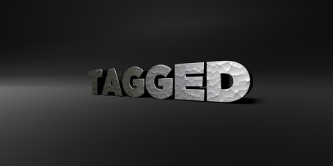 TAGGED - hammered metal finish text on black studio - 3D rendered royalty free stock photo. This image can be used for an online website banner ad or a print postcard.