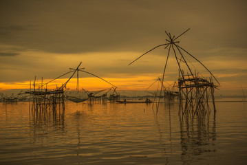 Fototapeta na wymiar Sunrise background with fishing equipment