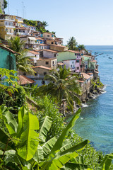 Colorful hillside favela architecture of the Solar do Unhao community overlooking the Bay of All Saints in Salvador, Bahia, Brazil