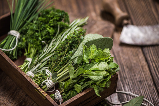 Fresh Aromatic Herbs On Kitchen Table