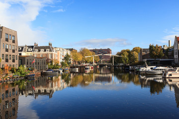 Naklejka na ściany i meble Beautiful view of canals in autumn sunny day, Amsterdam, Netherlands 