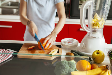 Obraz na płótnie Canvas Young Woman In A Kitchen