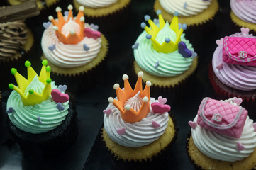 Fancy halloween cupcakes with Chanel bags and crowns