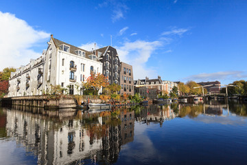 Beautiful view of canals in autumn sunny day,  Amsterdam, Netherlands 

