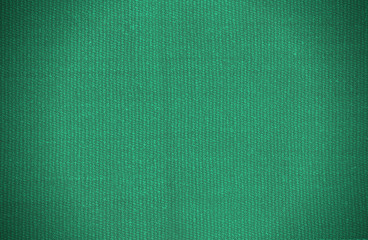 Natural background of thick green fabric. Fabric texture  for background. Vignette background