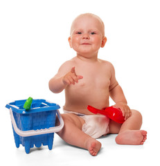 Happy little boy and plastic toys isolated on white.