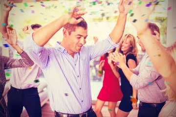 Composite image of young friends dancing together