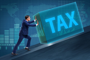 Businessman in high taxes concept