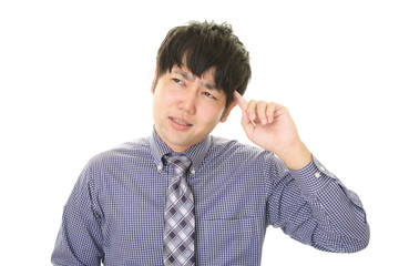 悩むビジネスマン