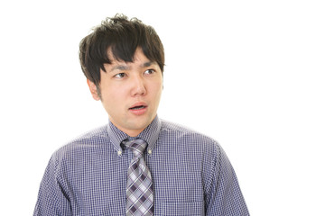 驚いた表情のビジネスマン