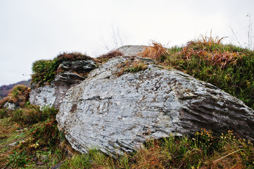 Big rocky stones at the foot of the mountain