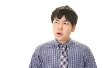 驚いた表情のビジネスマン