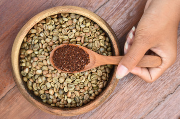 Coffee beans on wooden spoon