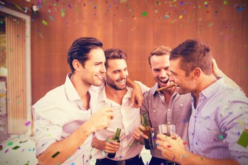 Composite image of group of young men having drinks