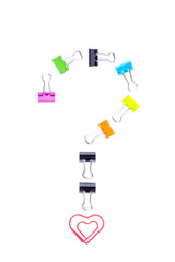 Question mark symbol made by multicolored paper clip binders.
