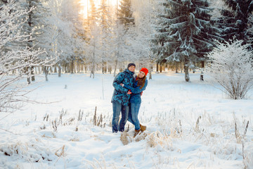 Fototapeta na wymiar two lovers hugging in the background winter Park