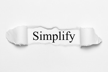 Simplify on white torn paper