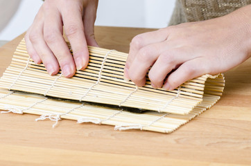 Woman is making rolls in her kitchen