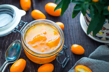 Delicious Orange Jam in Jar on Dark Wooden Table, Close-up View