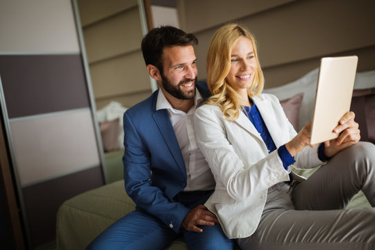 Couple on business trip using tablet