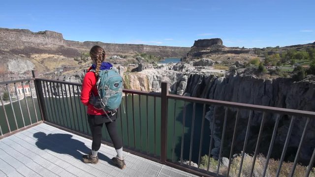 Backpacker Girl Taking Pictures with her Smartphone Shoshone Falls Idaho