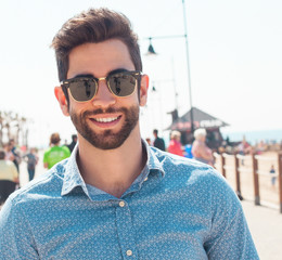 young man smiling in the beach