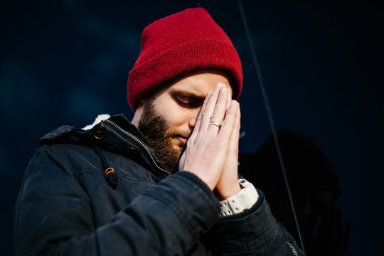 Man praying outside to God