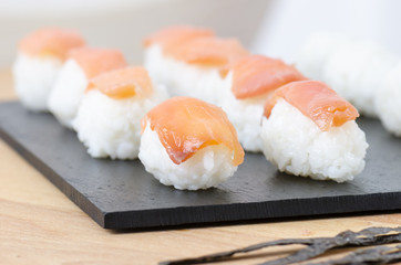 Sushi nigiri set on slate plate.