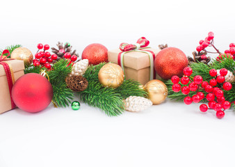 Christmas or New Year background: fur-tree, branches, gifts, colored glass balls, decoration and cones on a white background