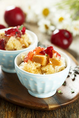 Plum dessert with cream cheese and biscuit