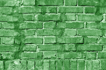 Grungy green toned brick wall texture.
