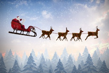 Composite image of side view of santa claus riding on sleigh dur - obrazy, fototapety, plakaty