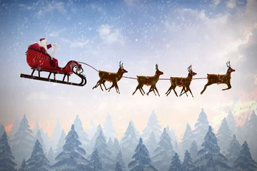 Fotobehang Composite image of side view of santa claus riding on sleigh dur © vectorfusionart