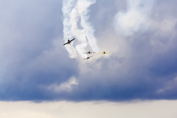 air show, small planes allowed smoke in the air showing the air acrobatics