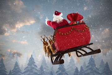Composite image of santa claus riding on sled with gift box