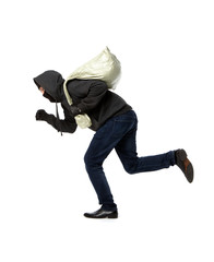 Thief runs with gray bag