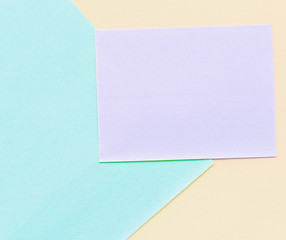 Different shape and pastel color bright note paper background