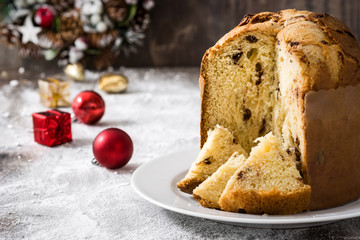 Christmas cake panettone and Christmas decoration on wooden background

